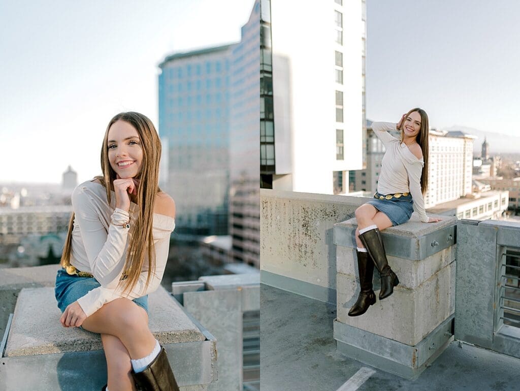 Senior girl smiling on a a rooftop with the city in the background.