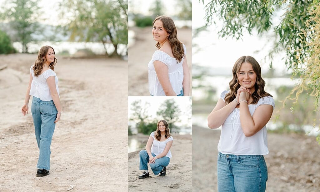 senior girl in white shirt and jeans smiles on the beach at Utah Lake